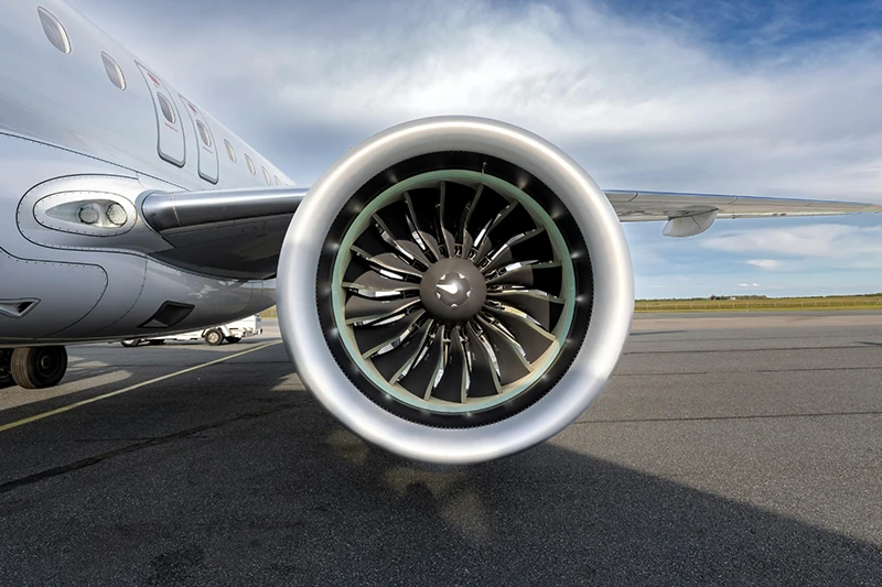 Image of an airplane engine on a post about turnkey manufacturing solutions for the aerospace industry